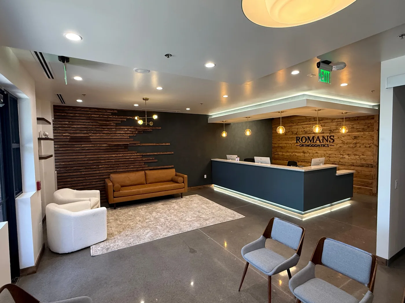 The reception desk and waiting area inside Romans Orthodontics in Anthem, Arizona