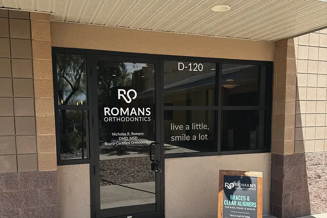 The Suite D-120 entrance to Romans Orthodontics on W. Anthem Way, at street level
